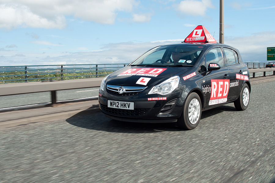 red driving school car